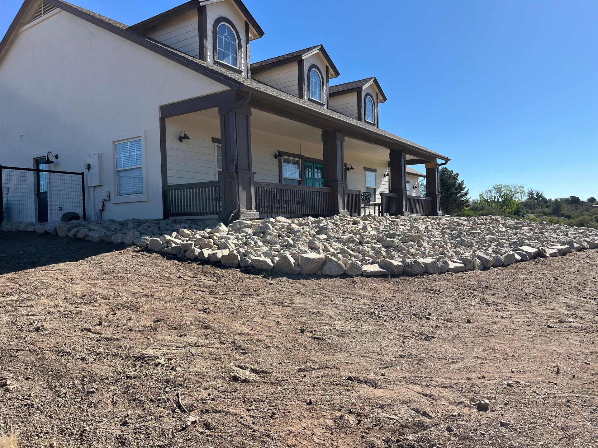 Gallery photos for Granite Riprap Retaining Wall Built for a Hillside Home in Williamson Valley: Image #1
